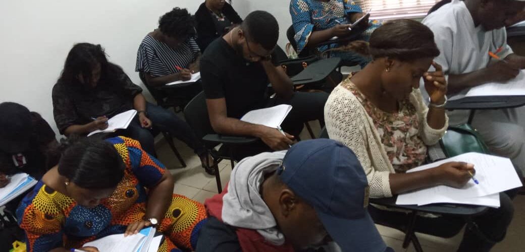 People writing exams at IELTS test centers in Nigeria